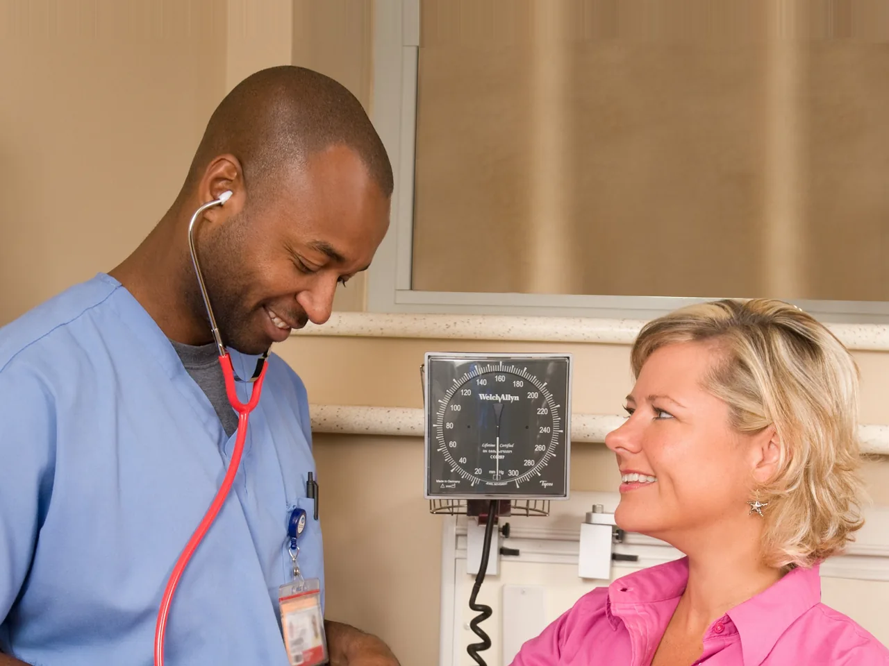 Clinician checking a patient's blood pressure