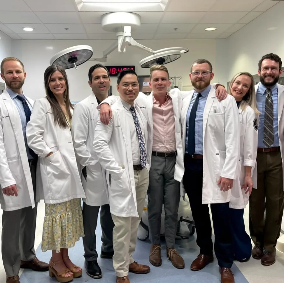 Residents in white coats